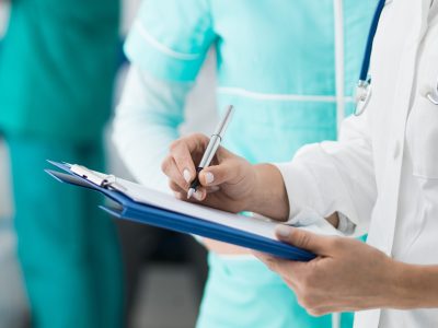 Doctors checking medical records